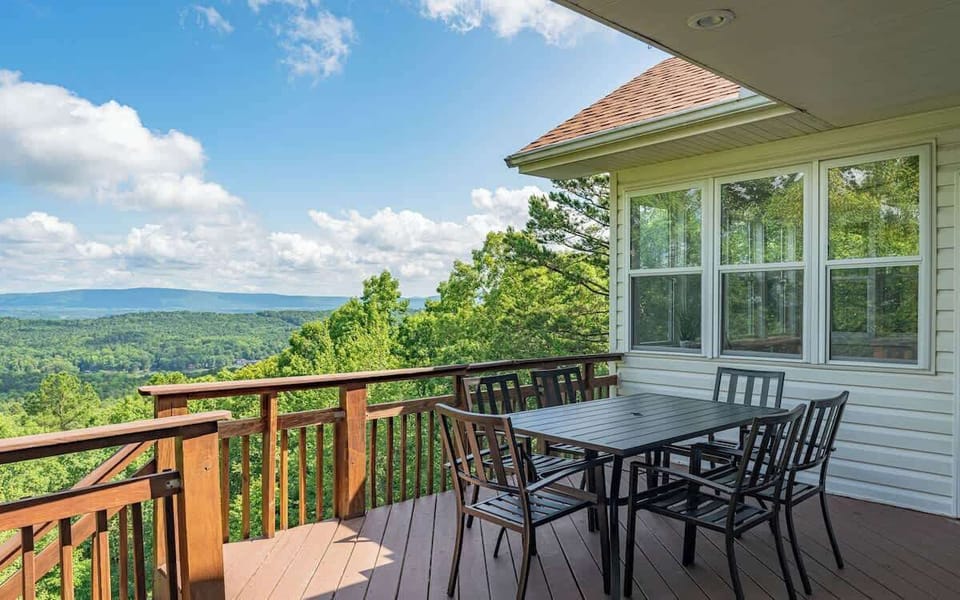 Enjoy outdoor dining with panoramic views on this covered deck—ideal for meals, conversations, and unforgettable moments.