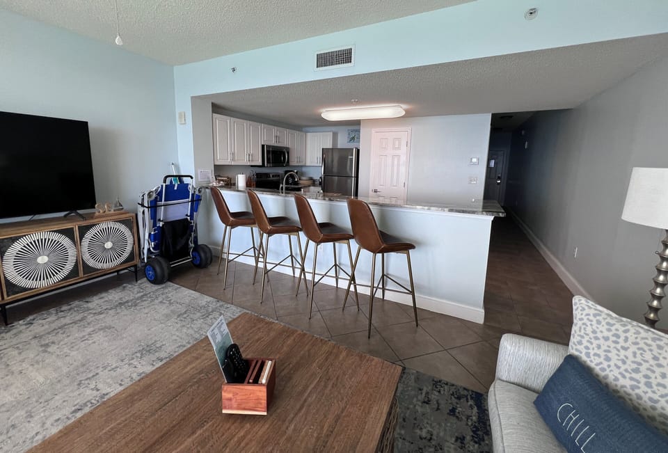 Comfortable bar height seating overlooking the spacious kitchen 