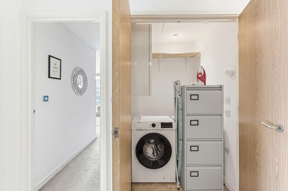 A convenient laundry area is available, complete with a washing machine, iron and ironing board.