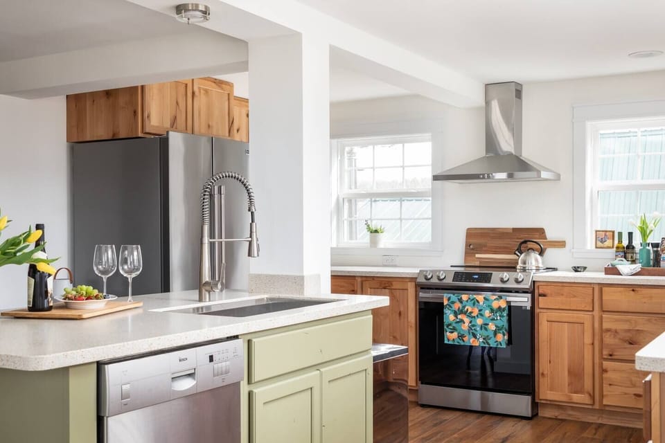 The spacious, fully-equipped kitchen features new appliances and ample counter space, inviting you to stock up at the farmer's market and prepare your favorite meals as part of your relaxation.