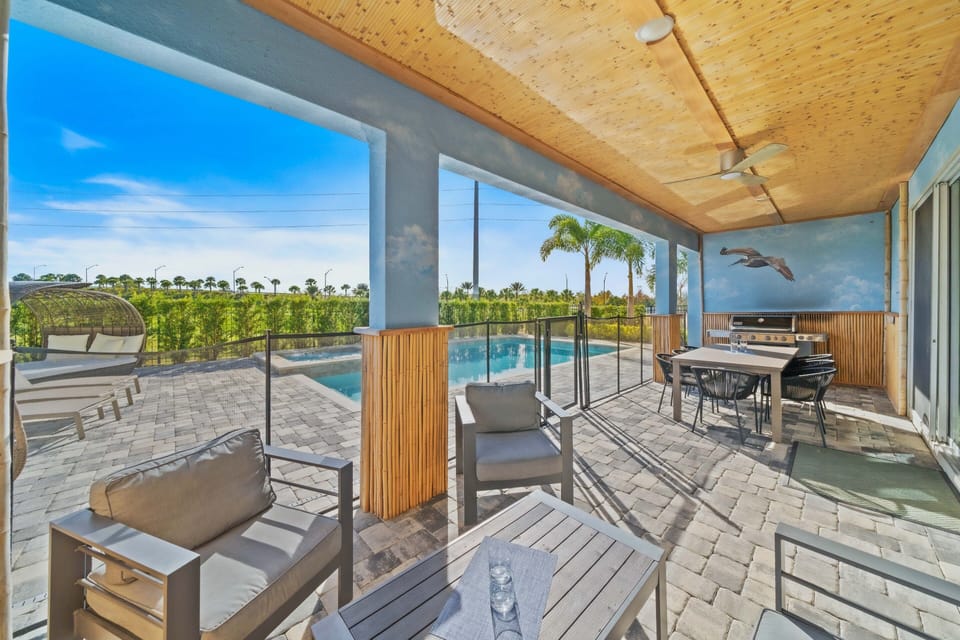 - Covered outdoor lounge with pool views and dining table  
- BBQ grill perfect for family cookouts under the sky  
- Relax in shaded comfort while overlooking palm trees
- This property no longer has a grill