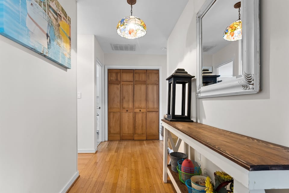 Hallways separates the bedrooms from downstairs family room.