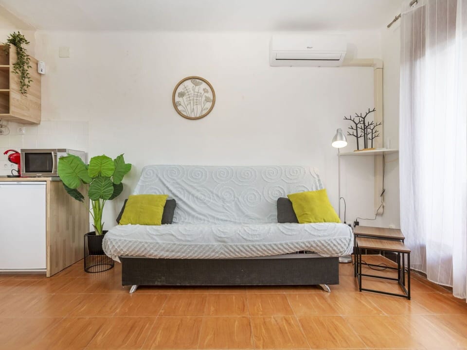 Furniture, Interior Design, Flooring, Couch, Floor, Wood, Room, Textile, Living Room, Lighting