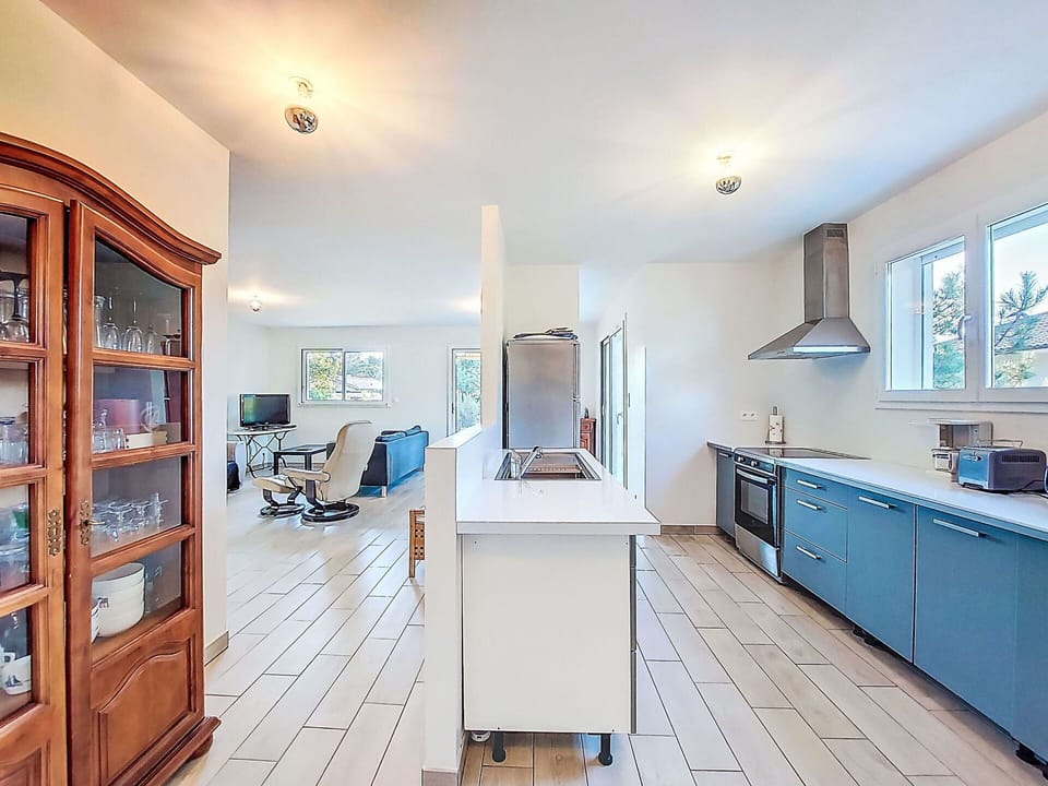 Flooring, Furniture, Interior Design, Floor, Countertop, Kitchen, Wood, Cabinetry, Ceiling, Wood Flooring