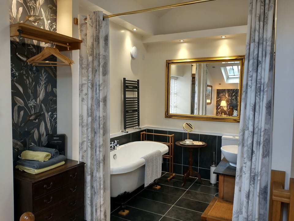 Fabulous ensuite bathroom in the garden suite with roll top bath.