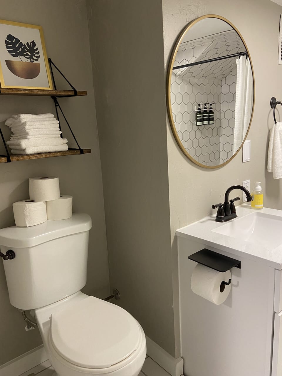Toilet in full bathroom is on a small step up platform