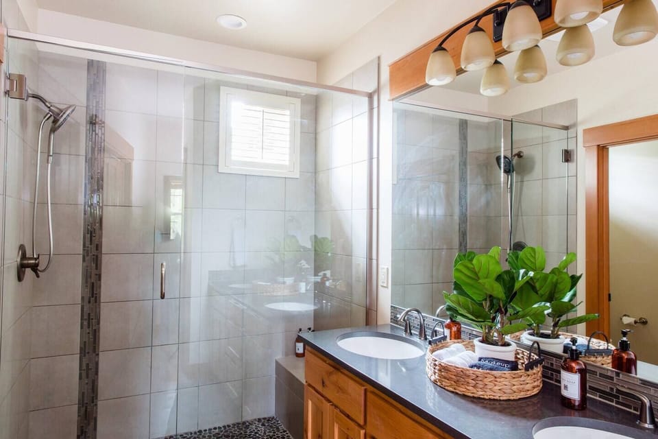 The primary bedroom features an ensuite bathroom with double sinks, large shower with seat, private toilet room and two large closets.