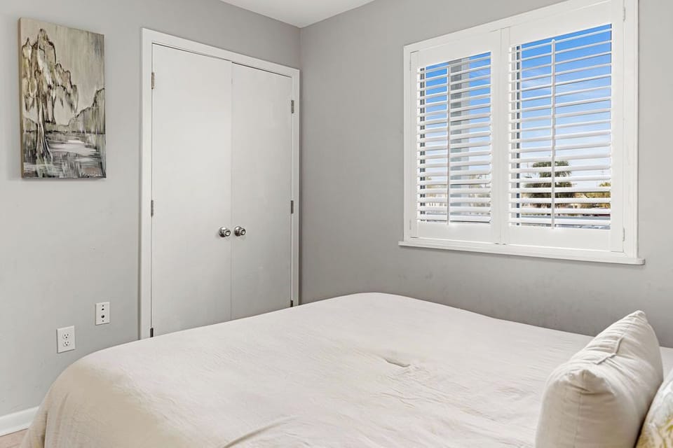 Bedroom 2 - Bedroom 2 features queen bedding and a spacious closet for storing your personal belongings out of sight.