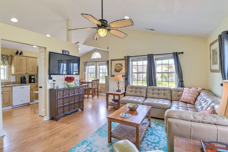 Relax in the spacious Living Area with plenty of natural light.