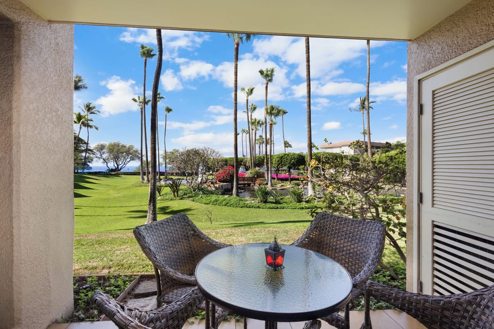 Sip your morning coffee on your private lanai overlooking lush gardens, swaying palms, and brilliant blue skies—your peaceful tropical retreat awaits.