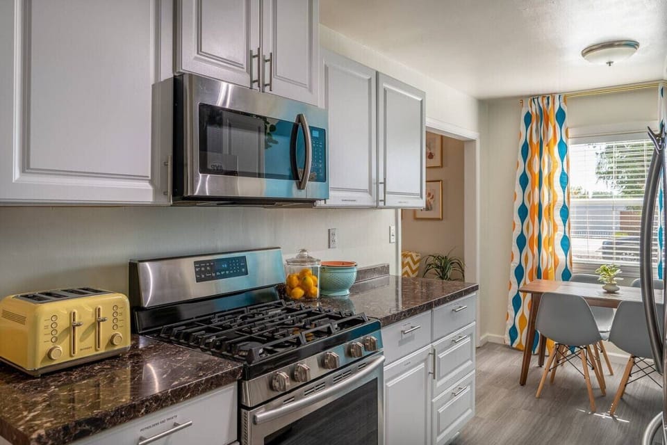 After a busy day exploring the sights of Southern California, come home to the comfort and convenience of our fully equipped kitchen. Our 5-burner gas range is ready to go, so you can whip up a delicious home-cooked meal for your family with ease.