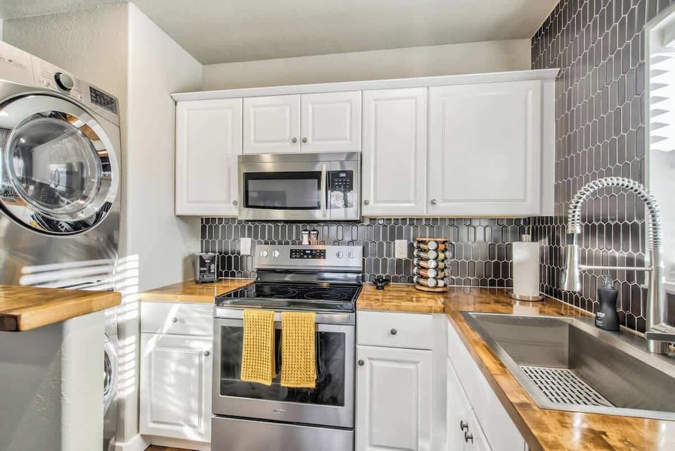 Fully stocked kitchen from pots and pans to utensils and baking sheets and a keurig!