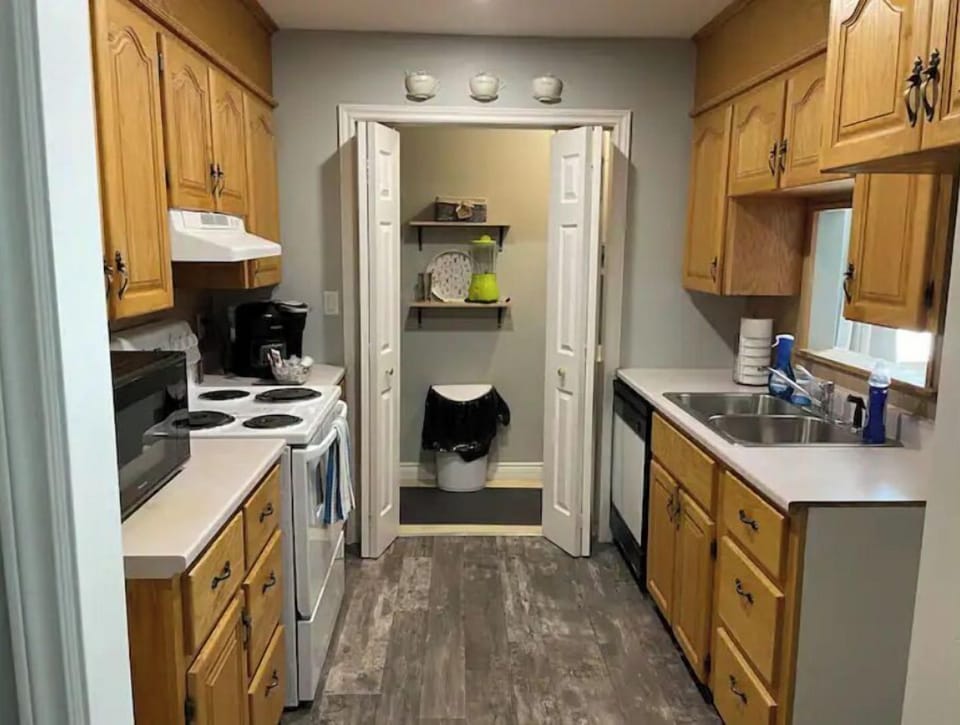 Fully stocked kitchen with pass through window and stackable washer/dryer
