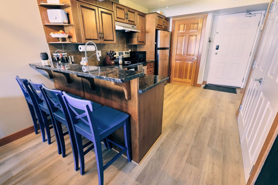 Fully stocked kitchen with all cooking amenities and ample seating