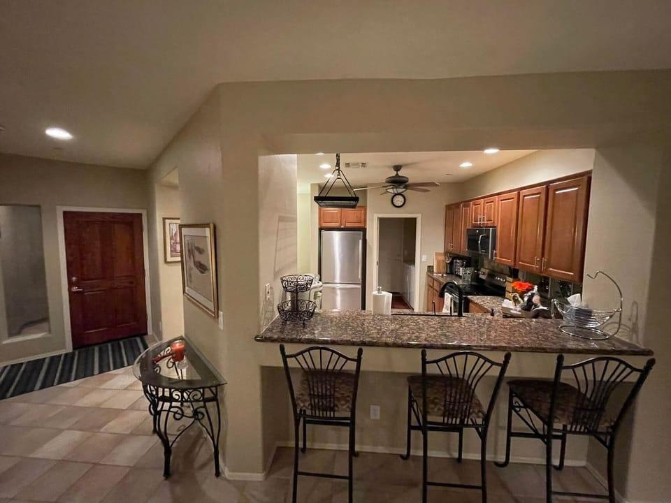 Kitchen, Bar Seating, & Entry