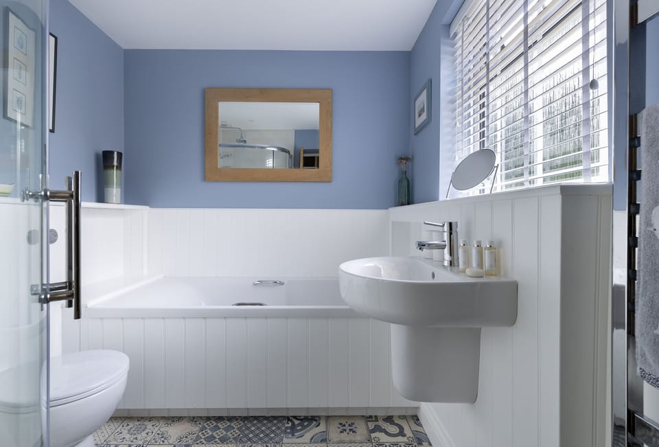 First floor: Family bathroom with bath, separate shower, wash basin, WC and heated towel rail
