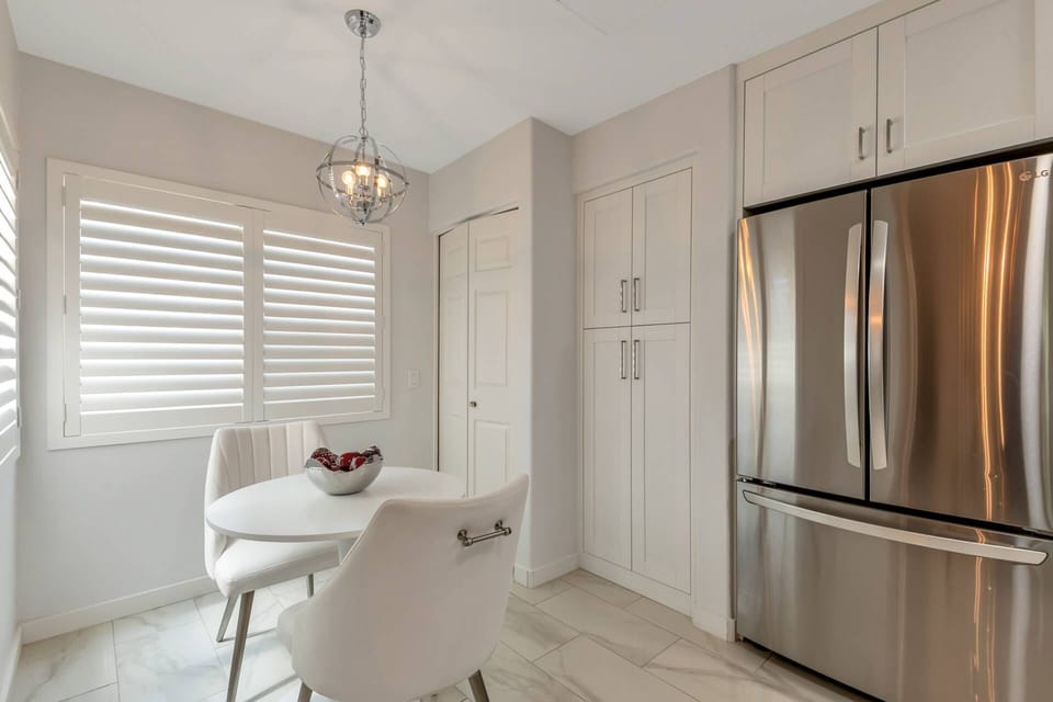 This area features full size washer & dryer in the closet and seating for 2 in the eat in kitchen