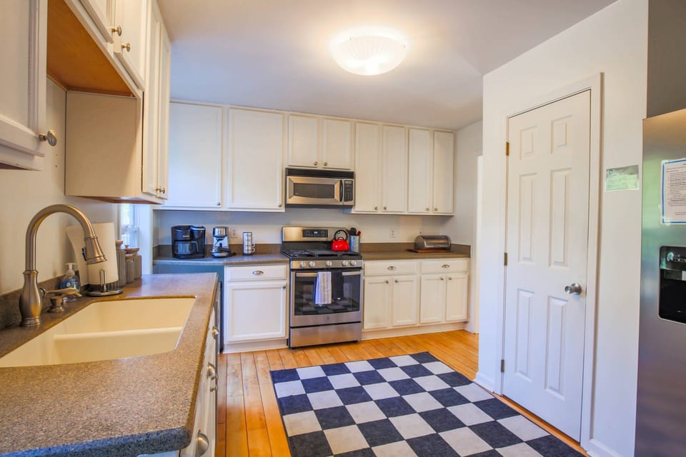 The Heron Hideaway kitchen features ample cabinets & counter space and a pantry.