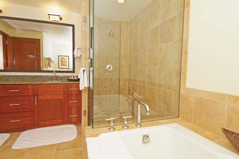 Primary Bathroom features a walk-in shower and soaking tub.
