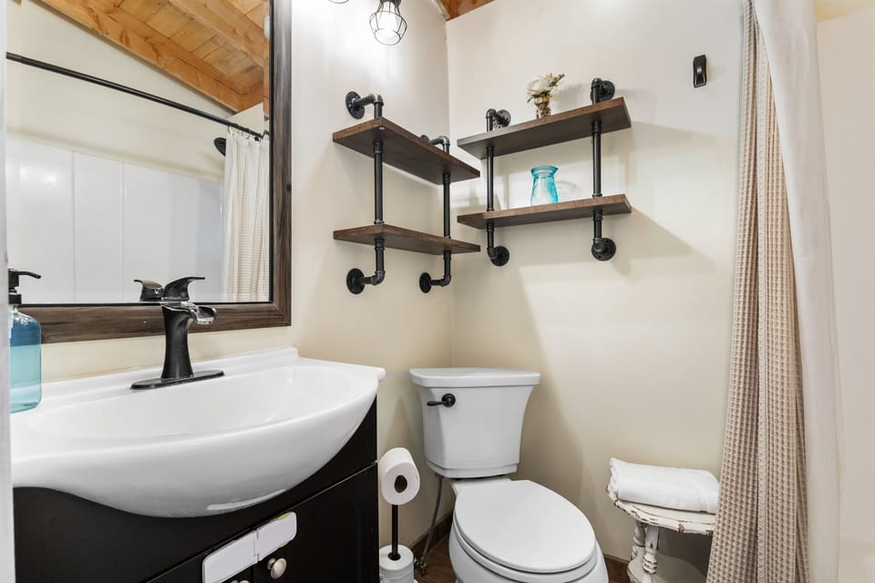 Bathroom #2: Shower/Tub, toilet and small vanity. This bathroom is located next to bedrooms 2 and 3.