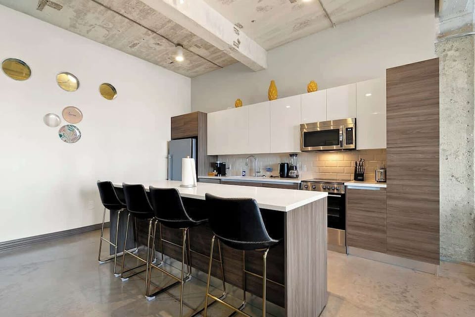 Channel your inner chef with sleek appliances and stylish seating!