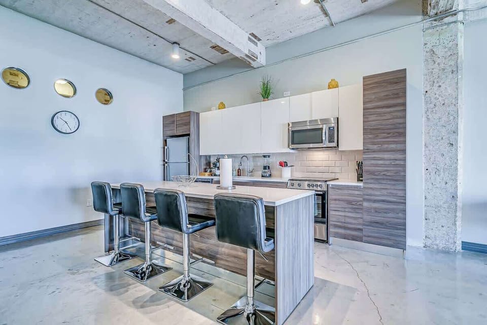 Modern appliances and sleek design make cooking a delight in this stylish space!