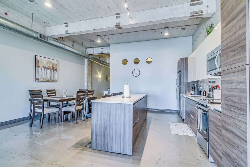 Sleek countertops and modern fixtures make cooking a delight in this vibrant space!