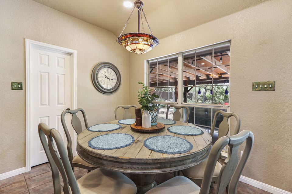 The dining space offers large windows brining in natural lighting.