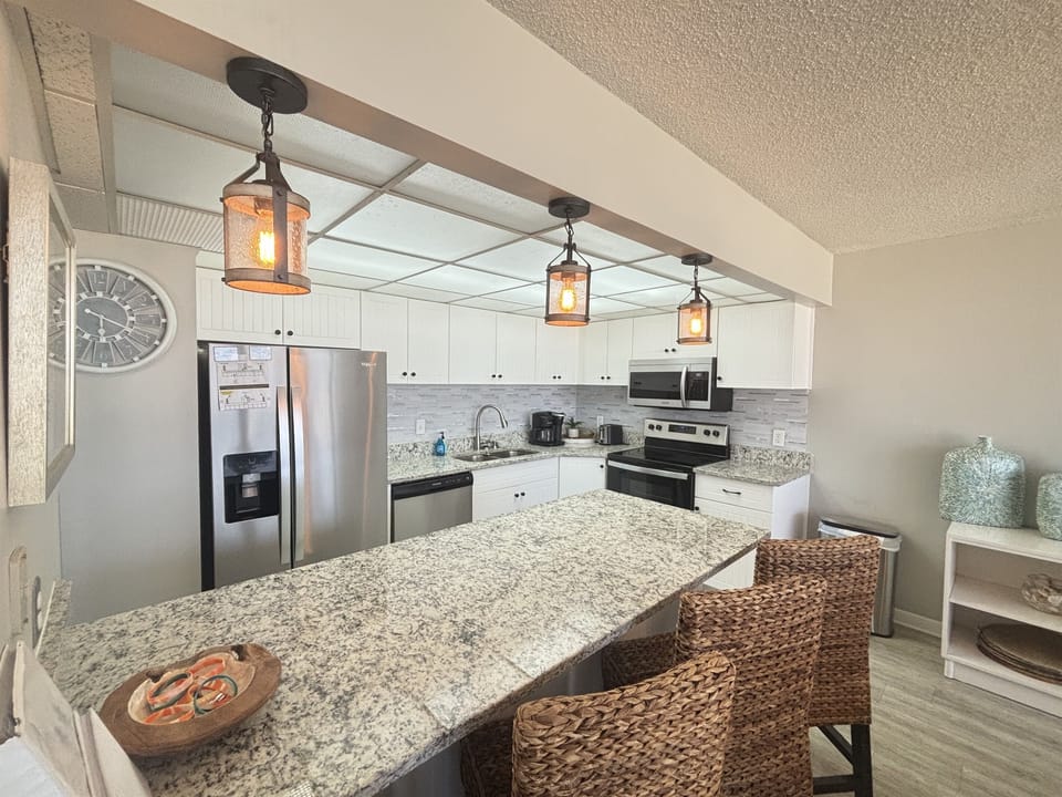 Kitchen with large island bar