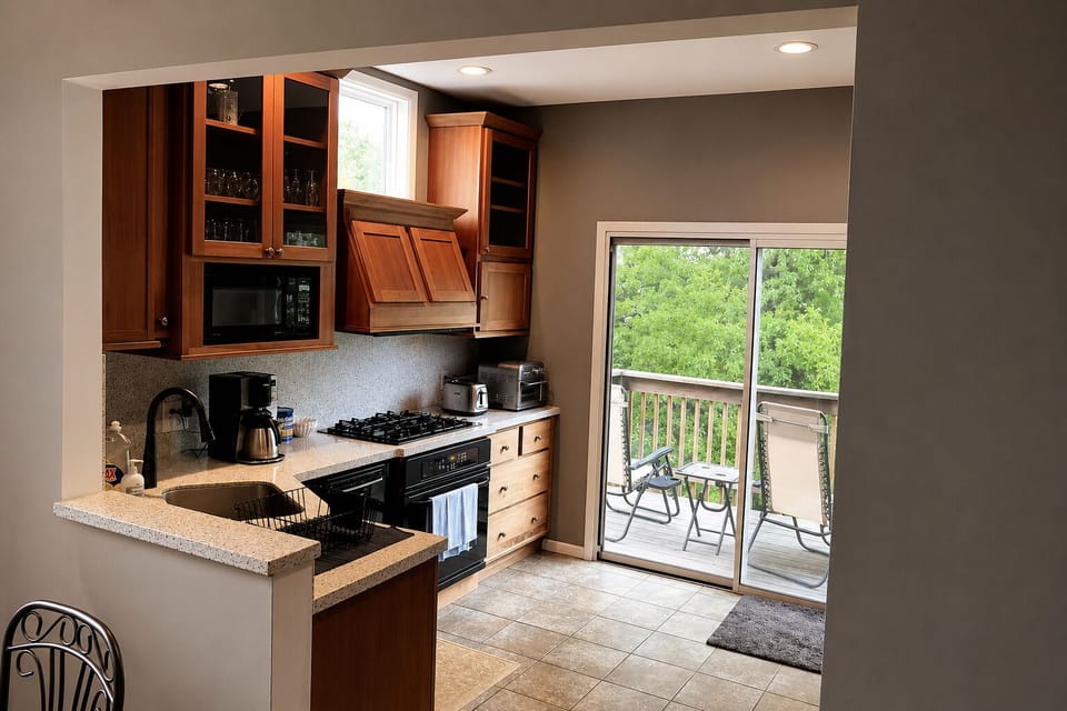 Another view of the kitchen with the deck in back
