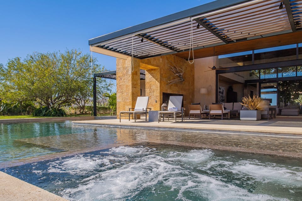 Poolside with view of villa