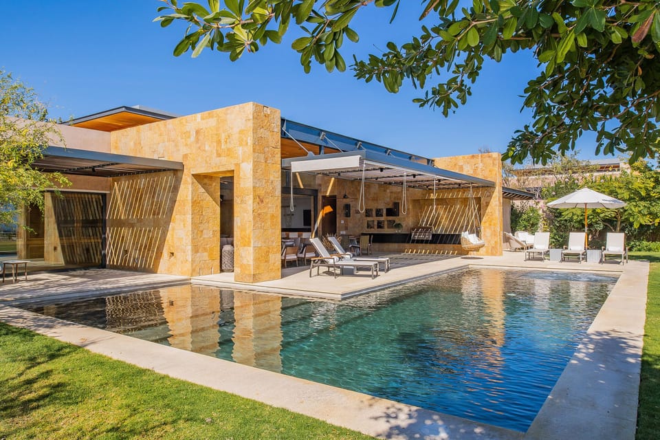 Poolside with view of villa