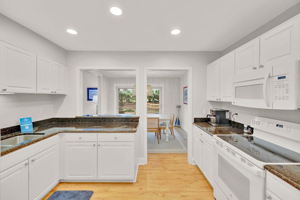 Kitchen with stainless steel appliances and fully stocked.