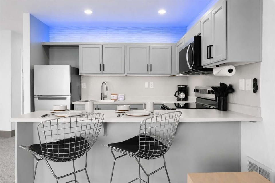 The kitchen is fully equipped with appliances