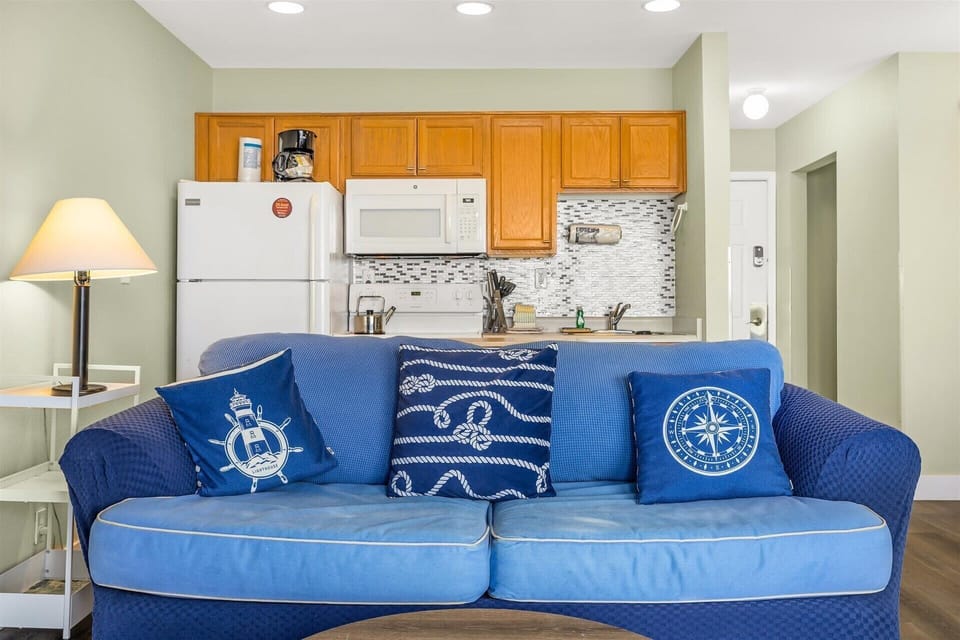 Just behind the sofa is your own kitchen space