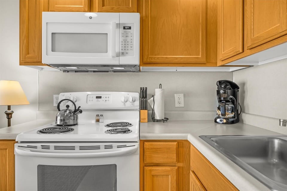 The kitchen comes fully equipped with cookware and appliances