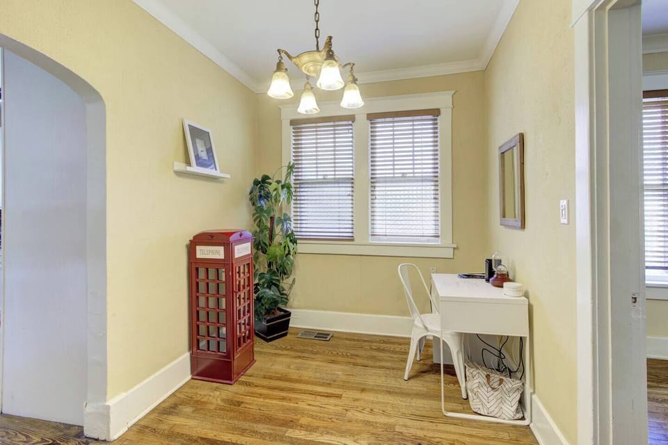 A spare little room next to the kitchen with a small desk and lots of natural light to get some work done.
