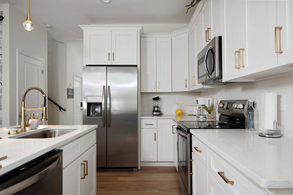 Brand new kitchen with golden fixtures