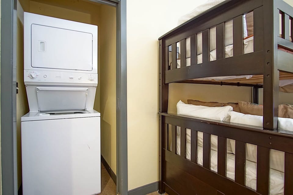 The washer/dryer is located in this room.
