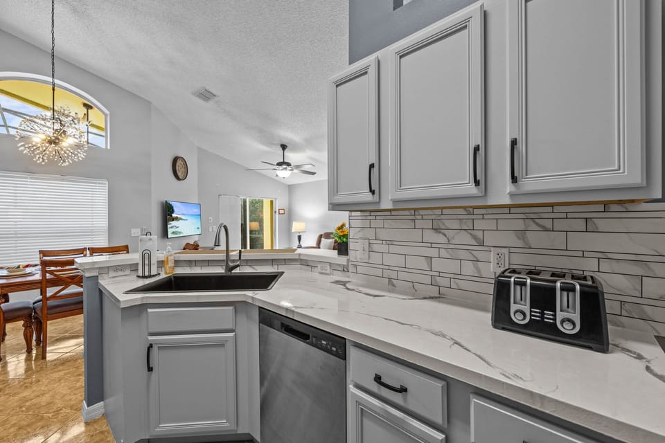 Fully stock kitchen with many small appliances. Nice deep sink.