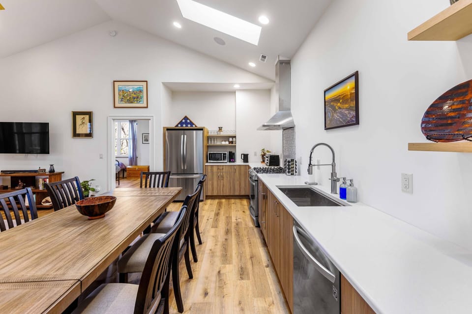 Spacious kitchen and dining area with modern amenities and rustic charm
