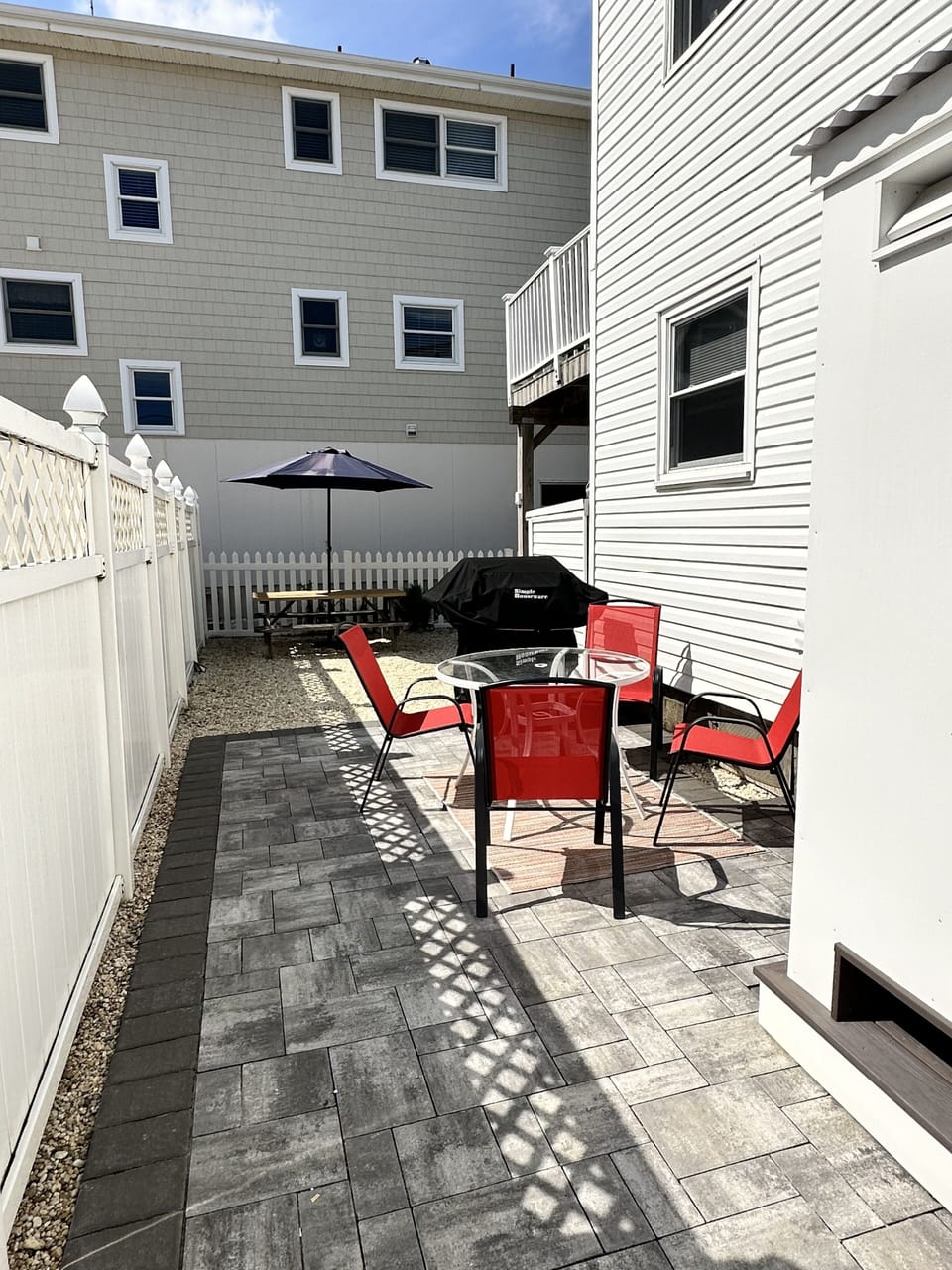 Outside patio space (outdoor shower partial shown on the right).