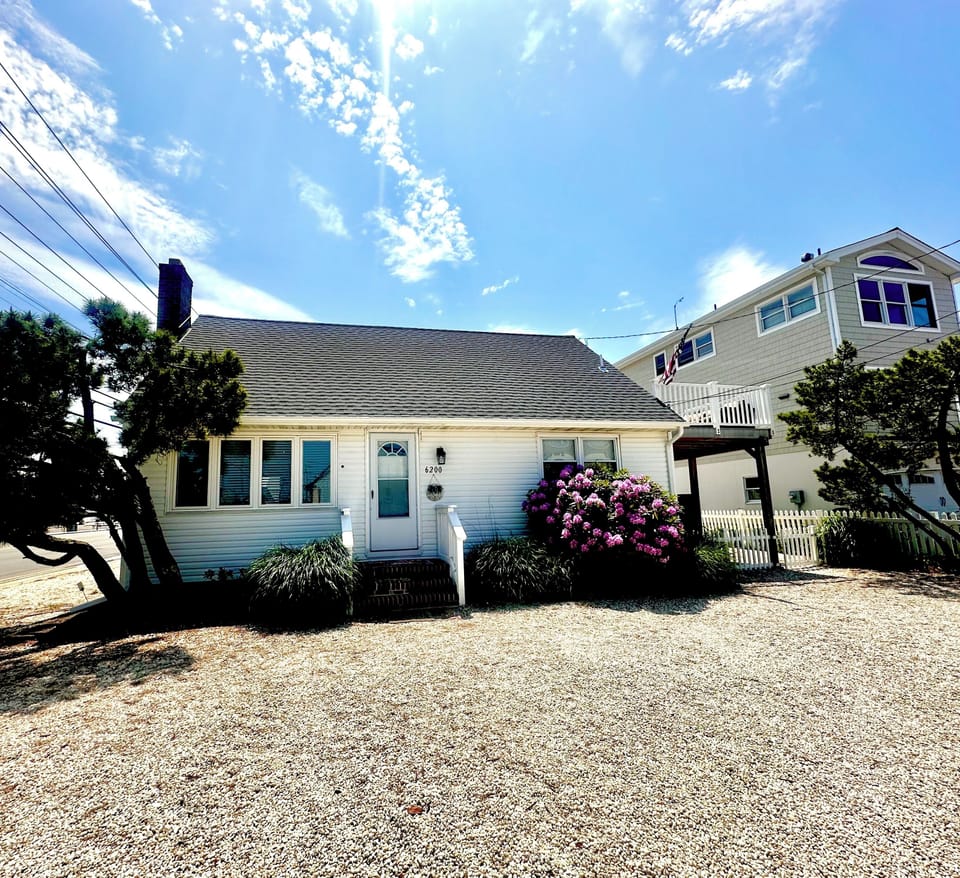 View of house from front yard. Space for 4 vehicles.