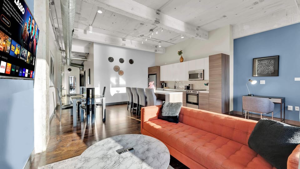 Living Room: Stylish design with sleek furniture and a modern kitchen island for entertaining!