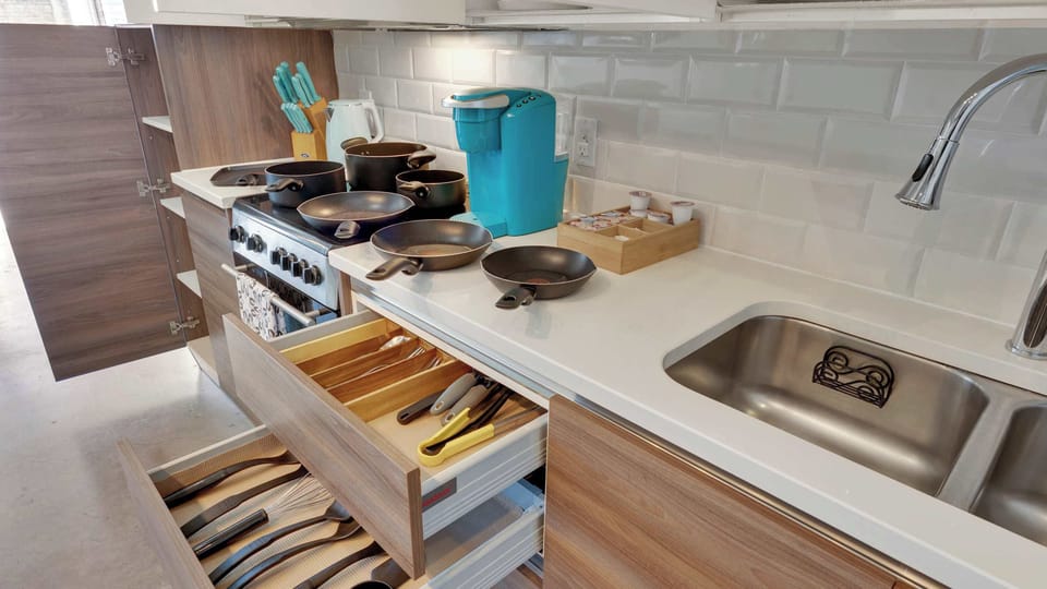 Kitchen: Cook up a storm in this well-equipped space, complete with modern cookware and vibrant decor!