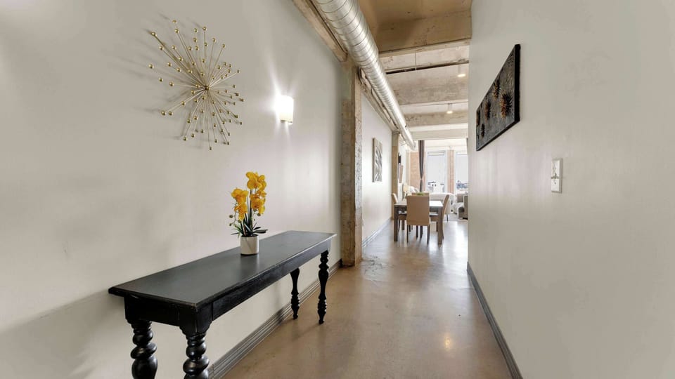 Hallway: Bright and airy, accentuated by modern decor and a stylish entryway table!
