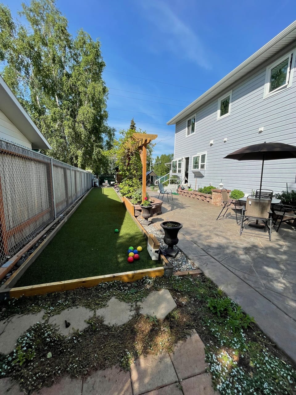 The Bocci Ball court and the backyard get lots of sun. 