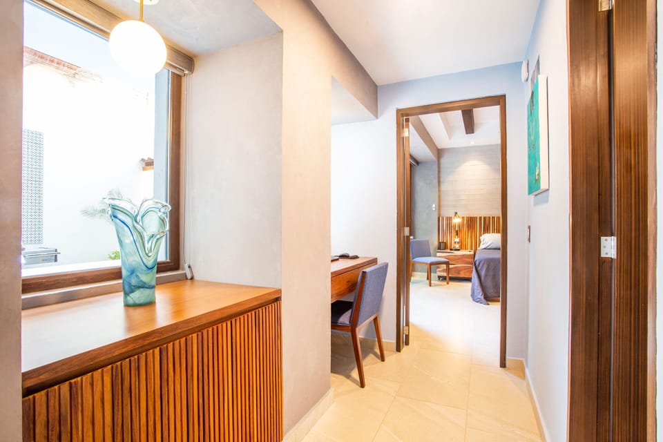 Hallway from Living Area to Workspace and Bedroom