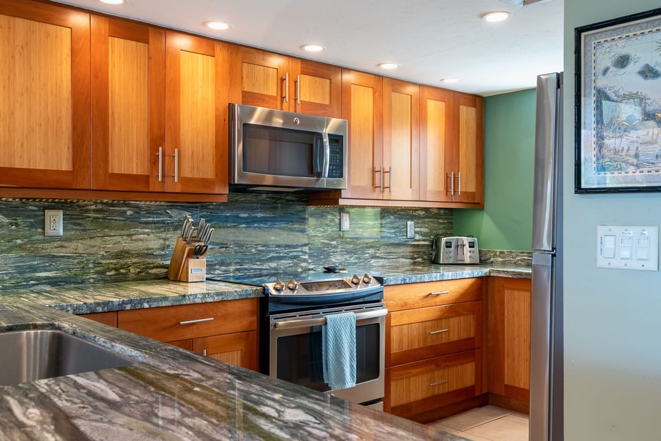 Simple elegant kitchen. Chef-ready kitchen with stove top, oven, and all necessary appliances for creating delicious meals in paradise.
