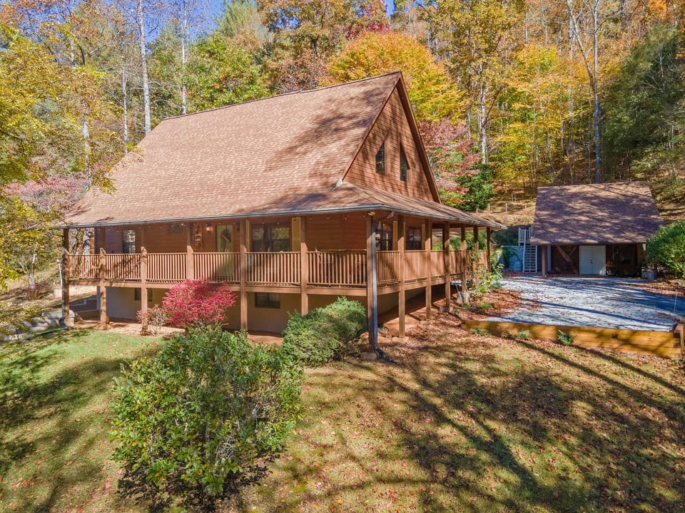 Easy access, plenty of parking, lots of space and wrap-around deck welcomes you!